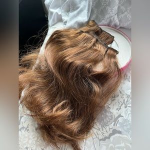 Beautiful clip in hair extensions color brown.